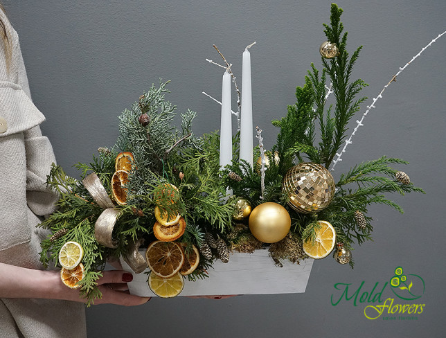 Table Composition with Christmas Tree and Golden Ornaments photo